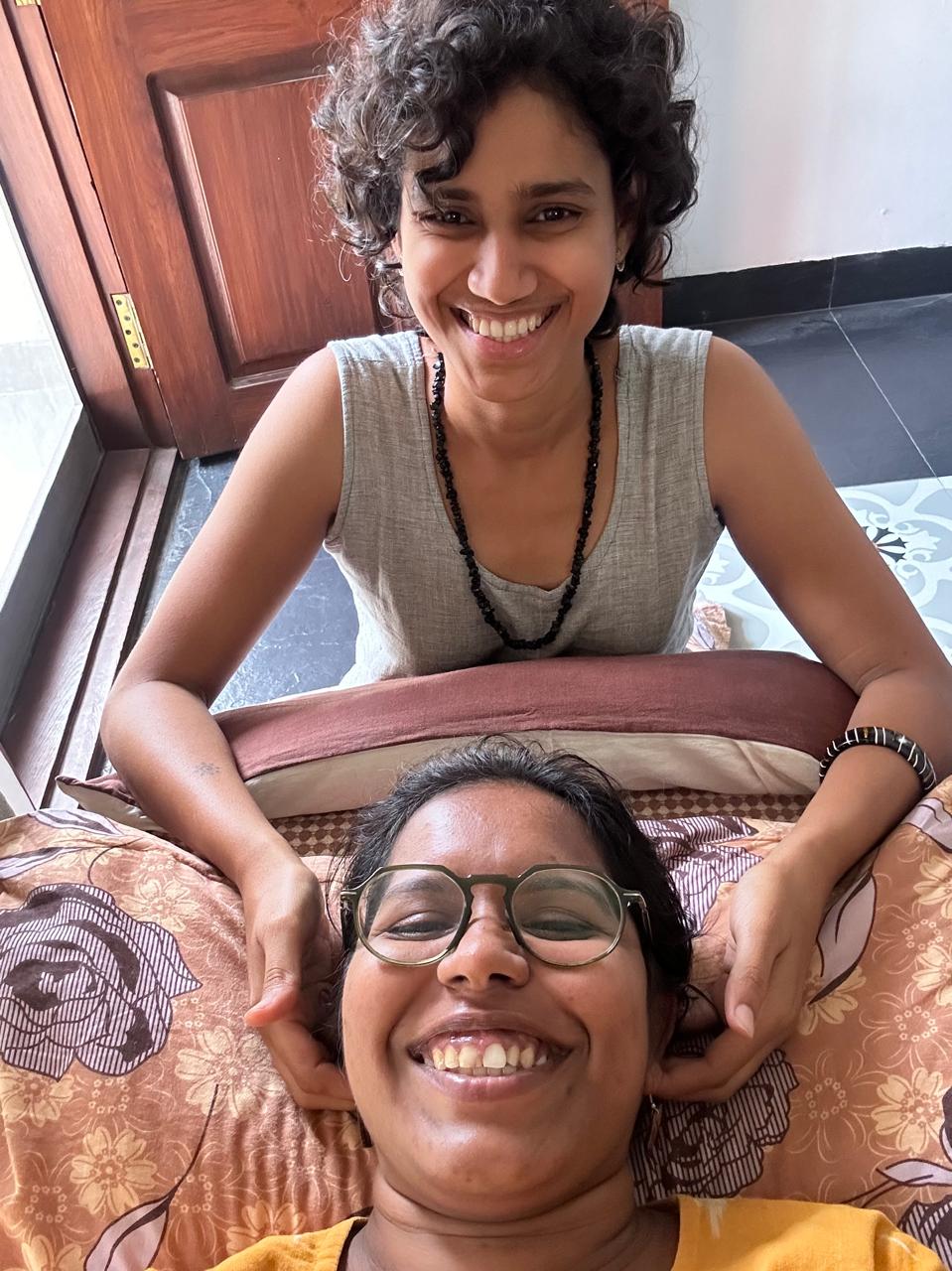 Likhitha and a client sharing a warm post-session smile together